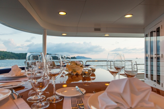 Motor Yacht Northern Sun for charter - main deck dining table.jpg