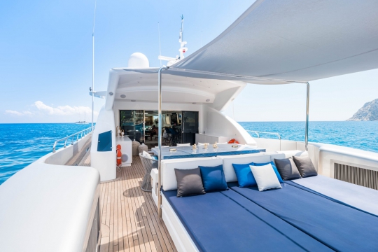 Tecnomar fast yacht for sale aft deck sunbeds