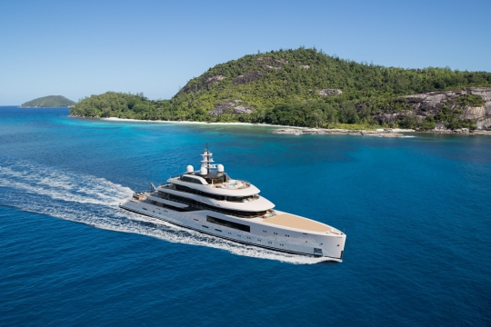 Amels 80 yacht for sale - cruising next to island