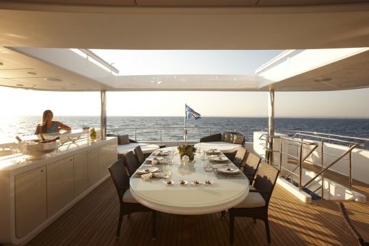 Motor Yacht E&E for charter - upper deck dining table 2